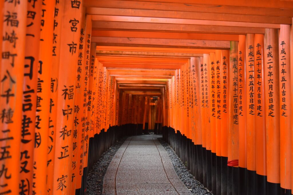 photo of walkway between shinto shrine